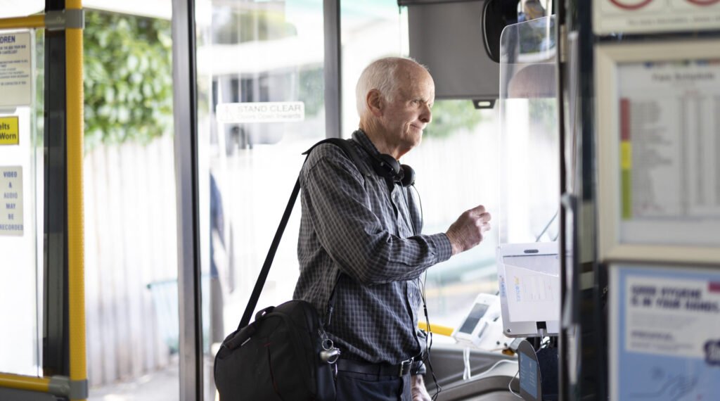Man paying to enter bus