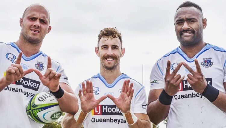 Queanbeyan Whites Forming a W from there hands